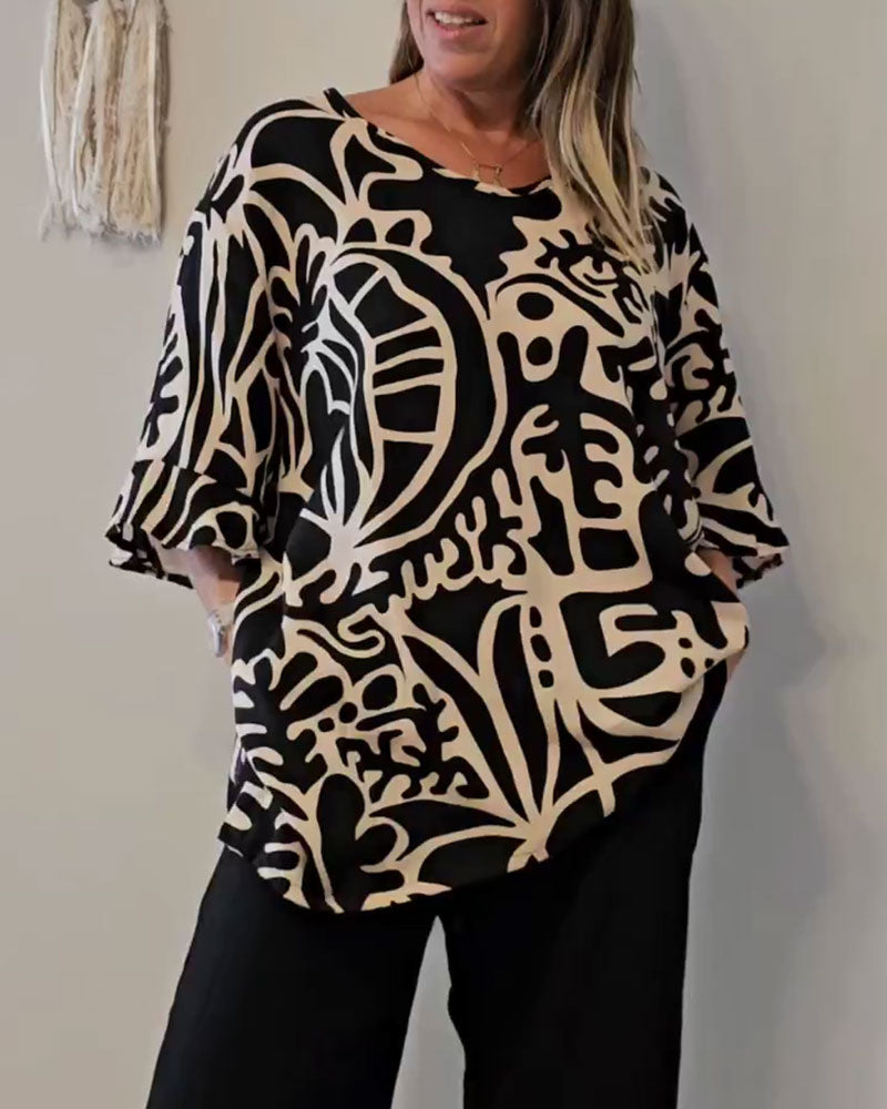 Elin - Ruime dames top met abstracte print en vloeiende mouwen