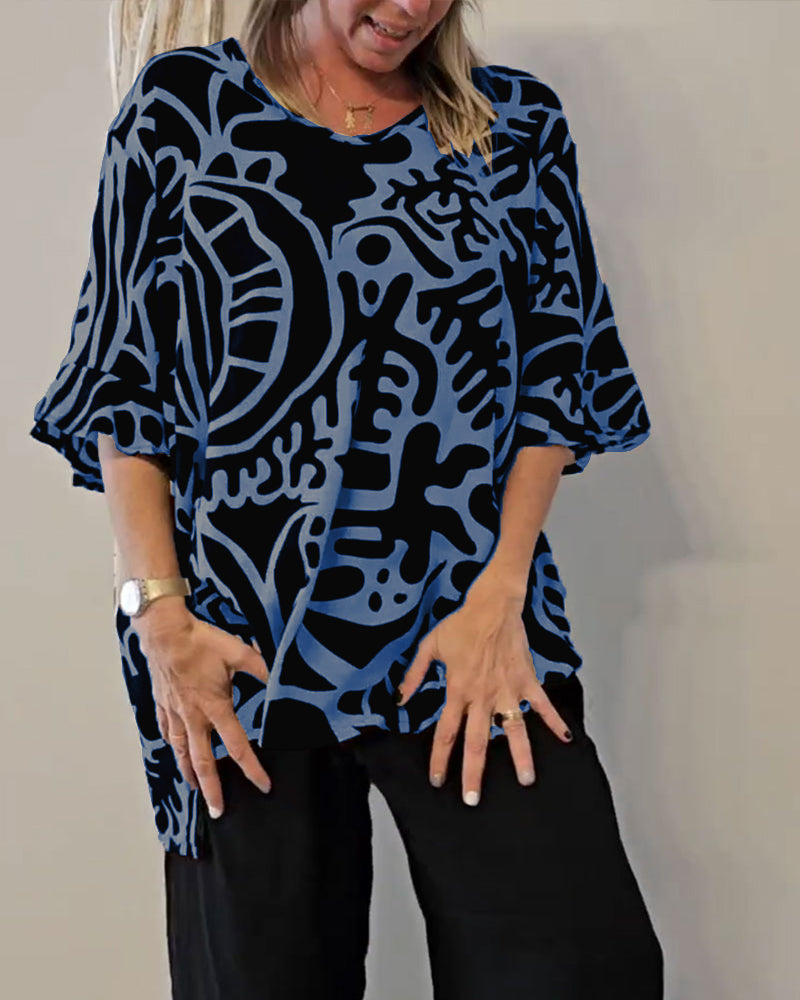Elin - Ruime dames top met abstracte print en vloeiende mouwen