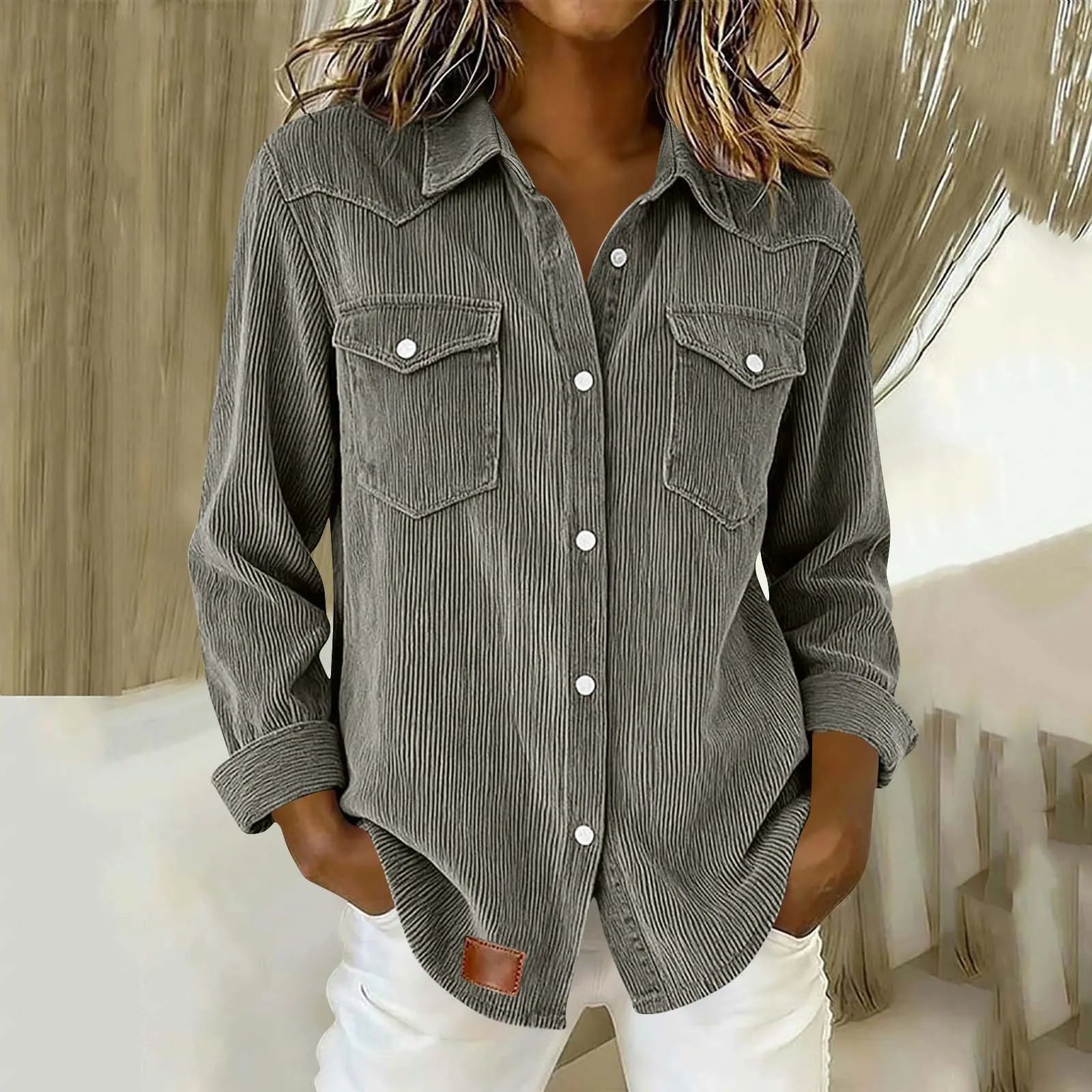 Sigrid - Gestreepte damesblouse met knopen en zakken