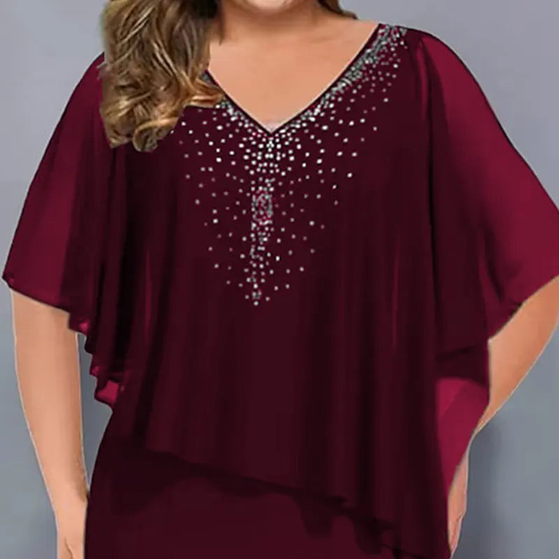Lorenne - Damescape jurk met strass en chiffon overlay